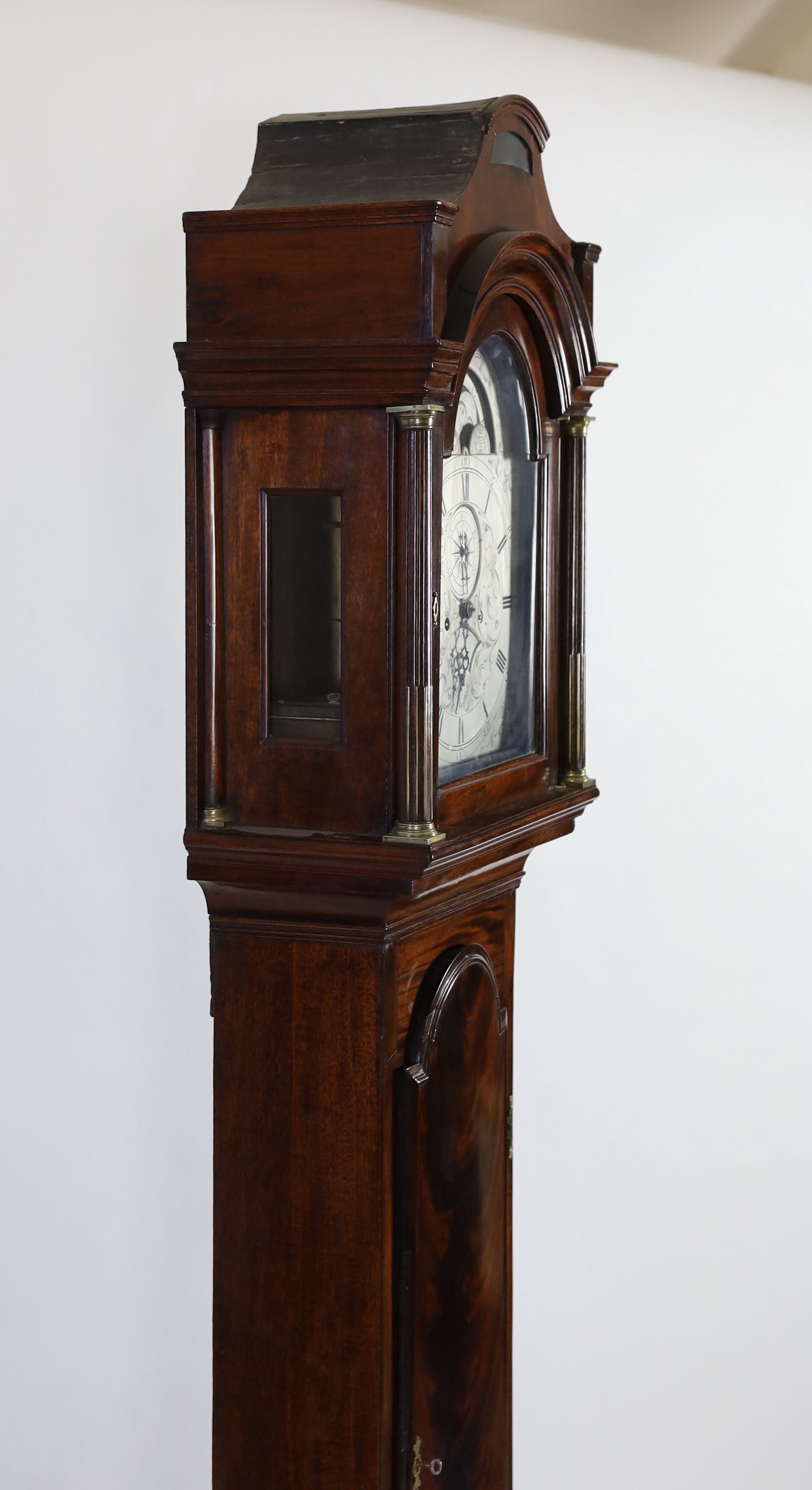 A George III mahogany cased eight day longcase clock, by Charles Clay, London, the 30cm arched silvered dial with moonphase, subsidiary seconds and calendar aperture, height 224cm